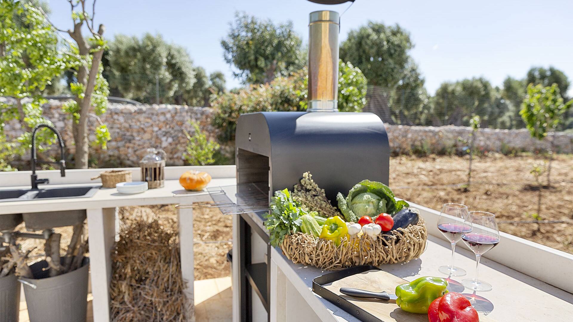 outdoor kitchenette with stone-made BBQ