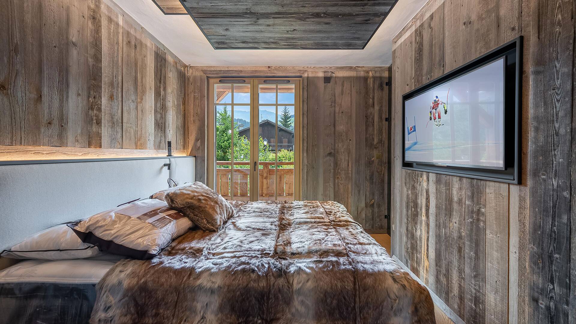 double bedroom with TV