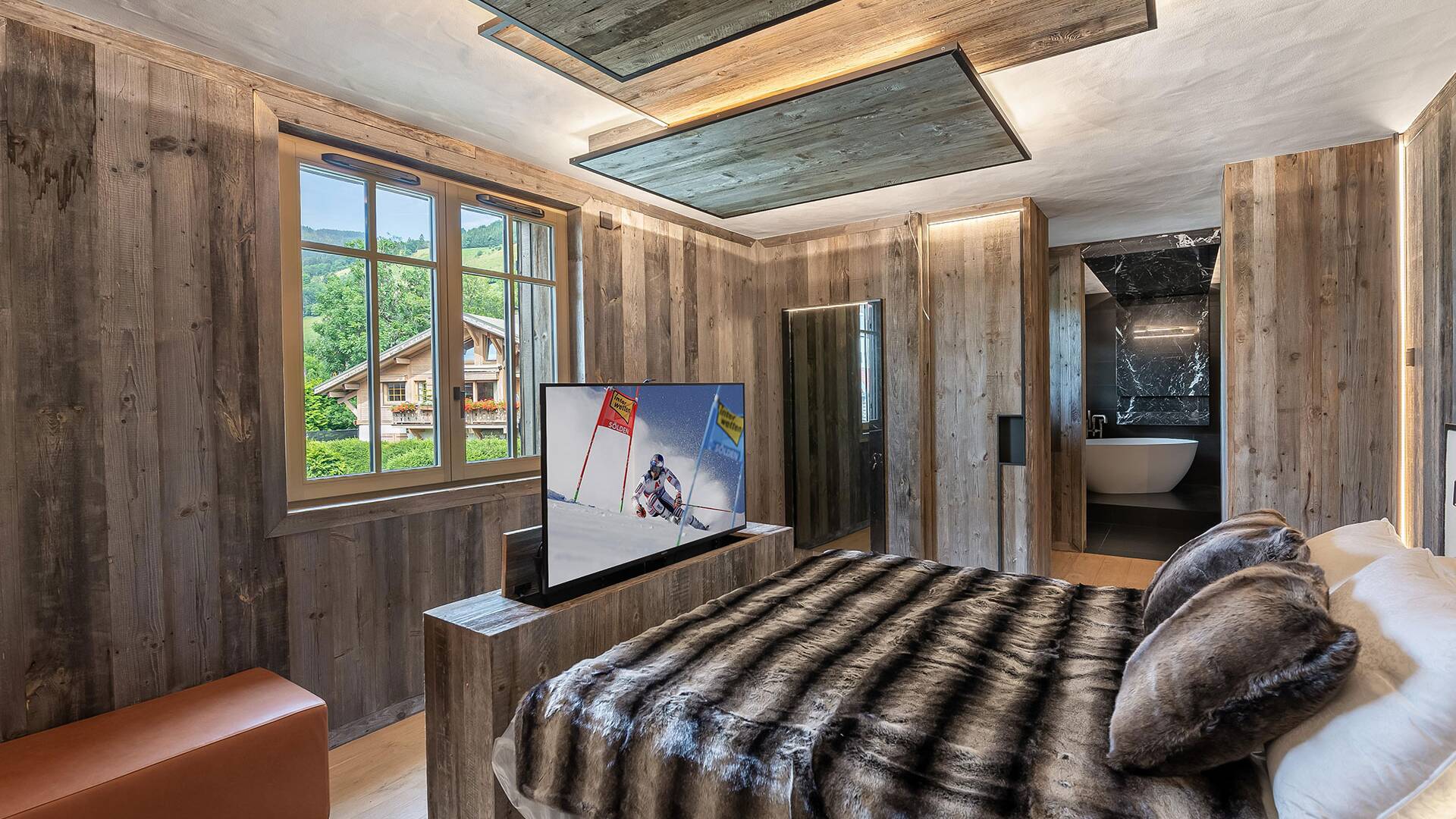 double bedroom with TV and en suite bathroom