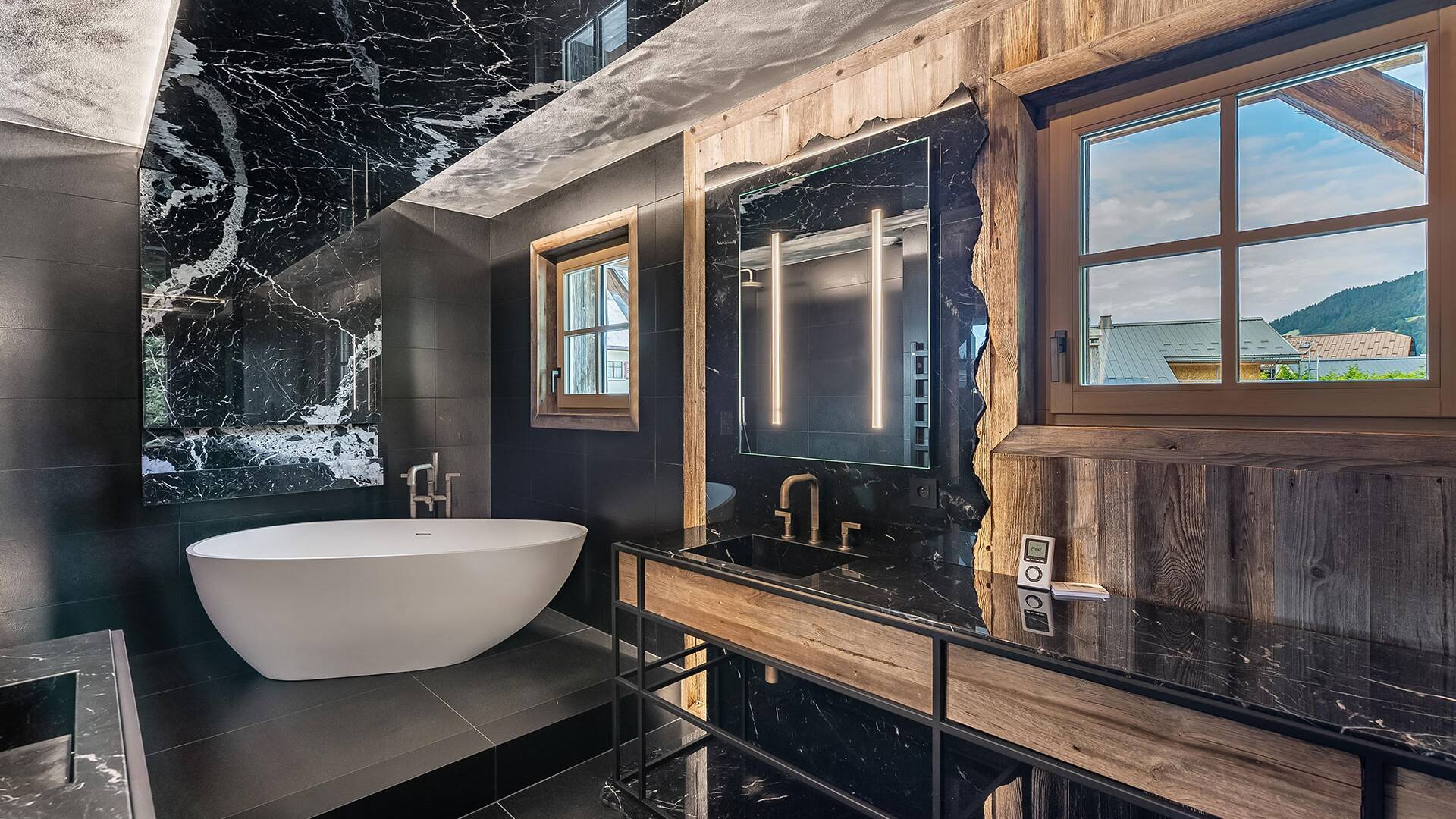 en suite bathroom with double lavabo and bath tub