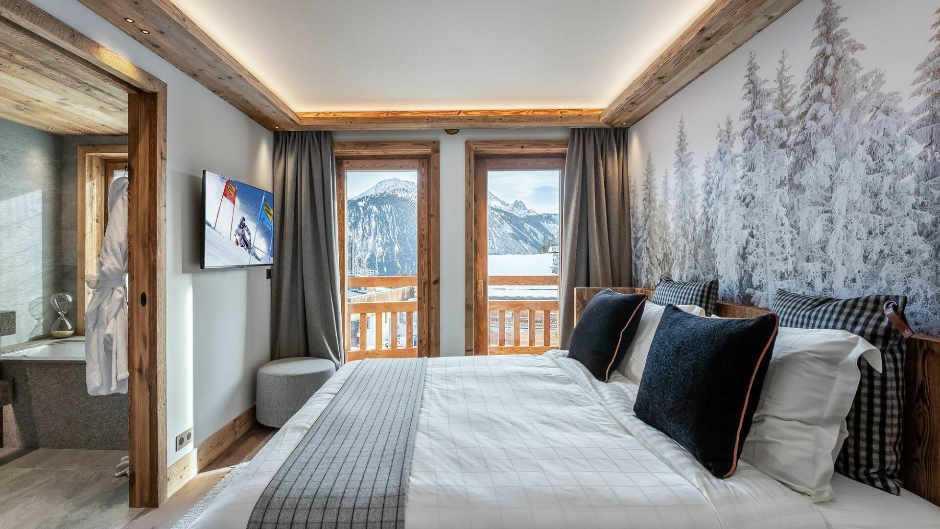 double bedroom with TV, access to outdoor and en suite bathroom