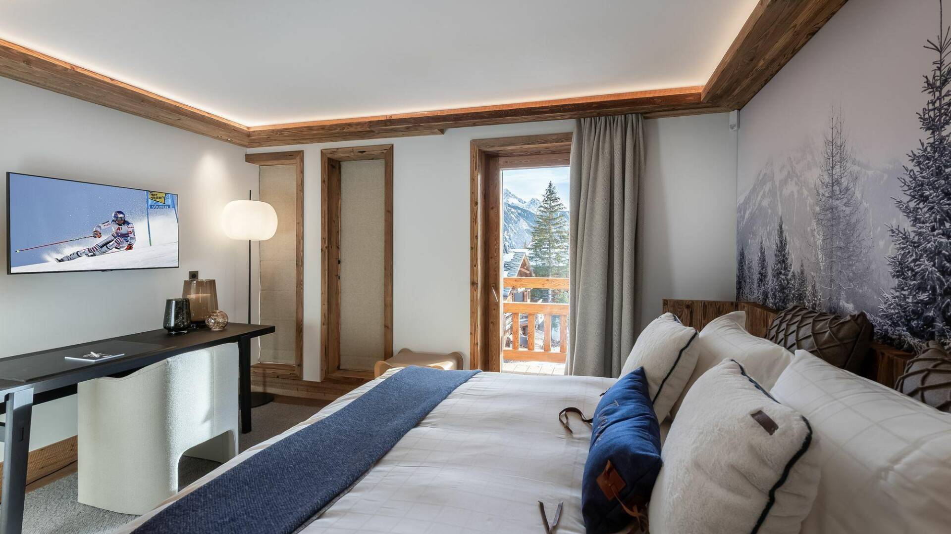 double bedroom with TV and access to balcony