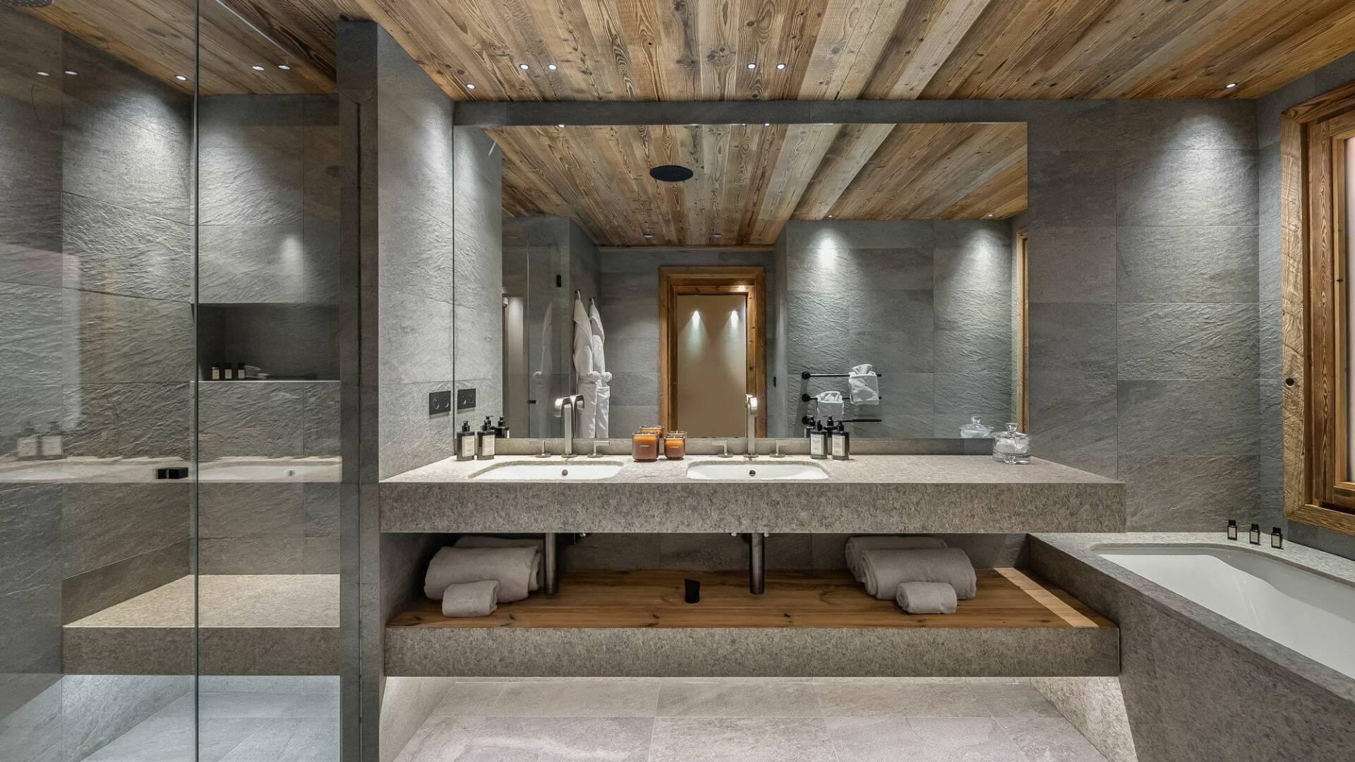 en suite bathroom with shower cabin and bath tub