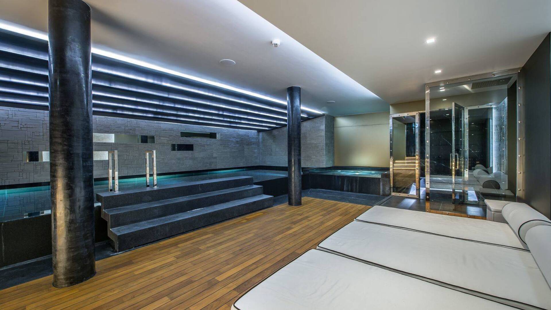 exclusive indoor pool with sunbeds