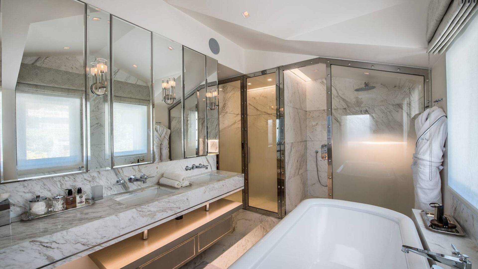 en suite bathroom with double lavabo, bath tub and shower cabin