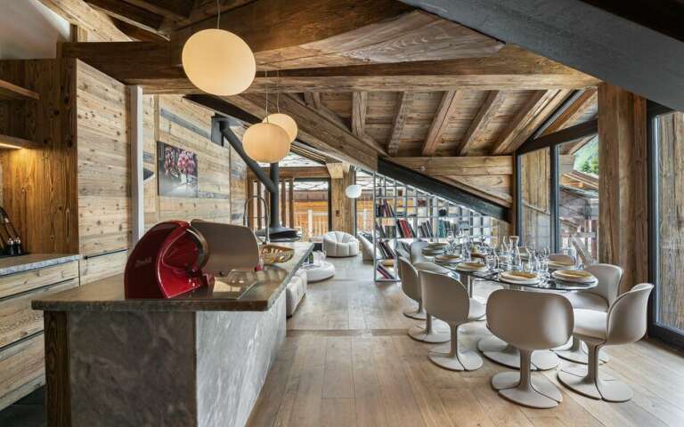 open space with gourmet kitchen and dining table