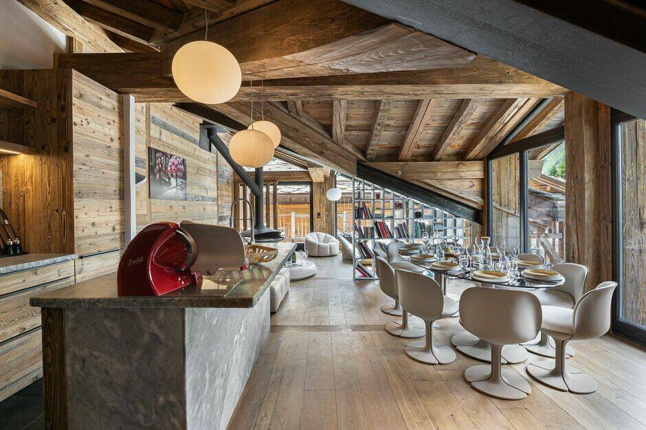 open space with gourmet kitchen and dining table