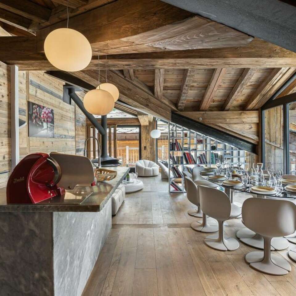 open space with gourmet kitchen and dining table