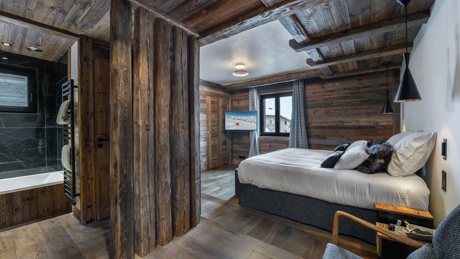 double bedroom with TV and en suite bathroom