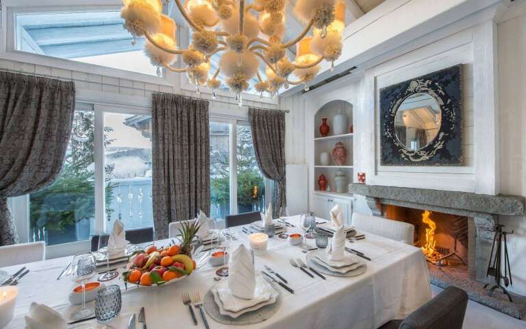 glamorous dining area with fireplace