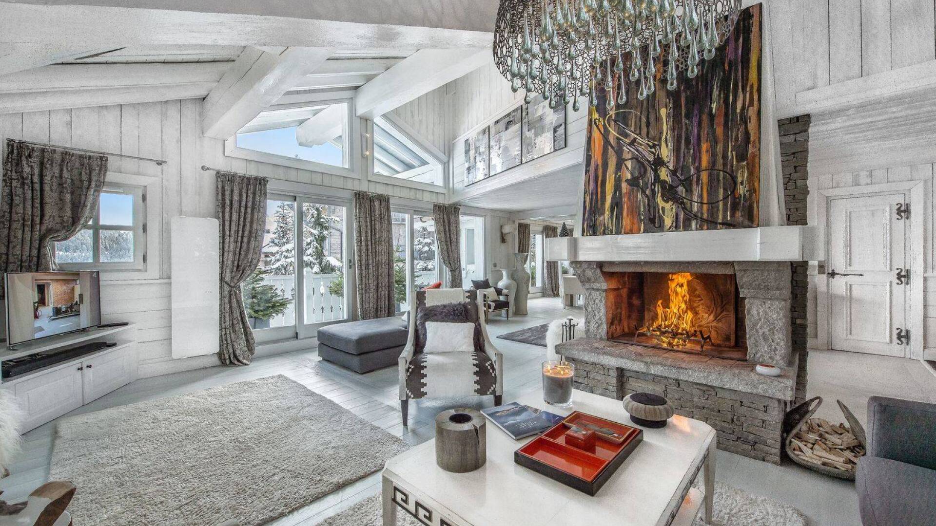 spacious living room with fireplace and majestic view over Courchevel