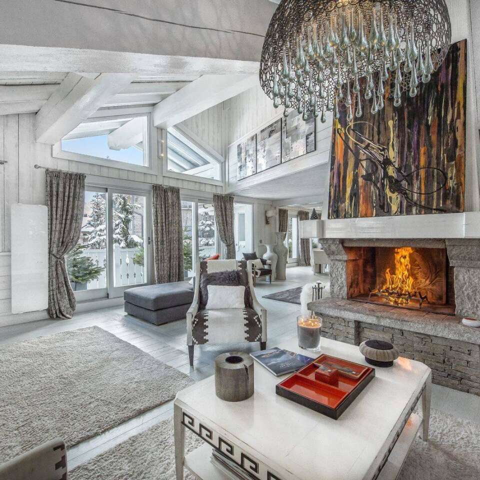 spacious living room with fireplace and majestic view over Courchevel