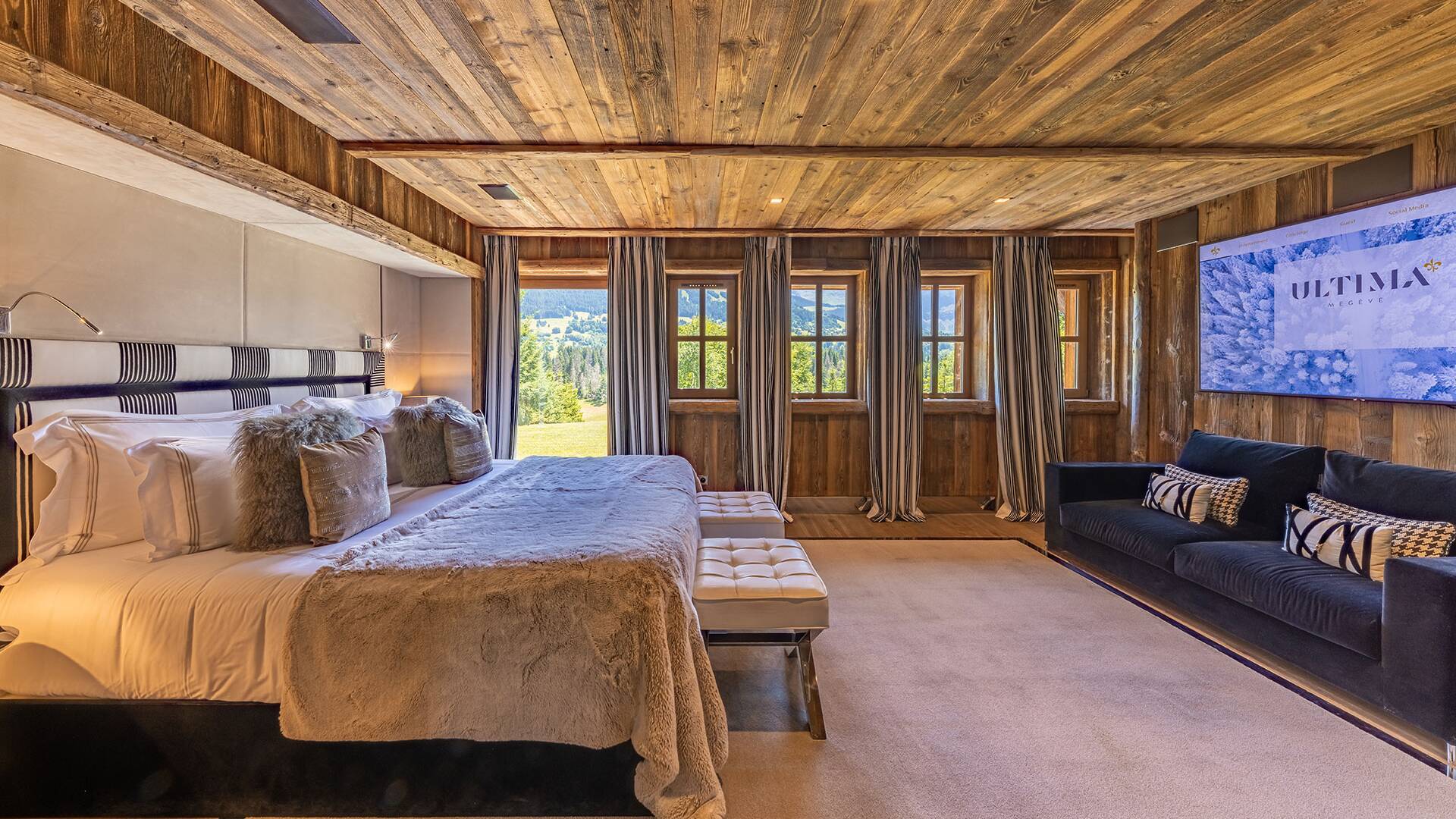 top luxury double bedroom with direct access to outdoor and large TV