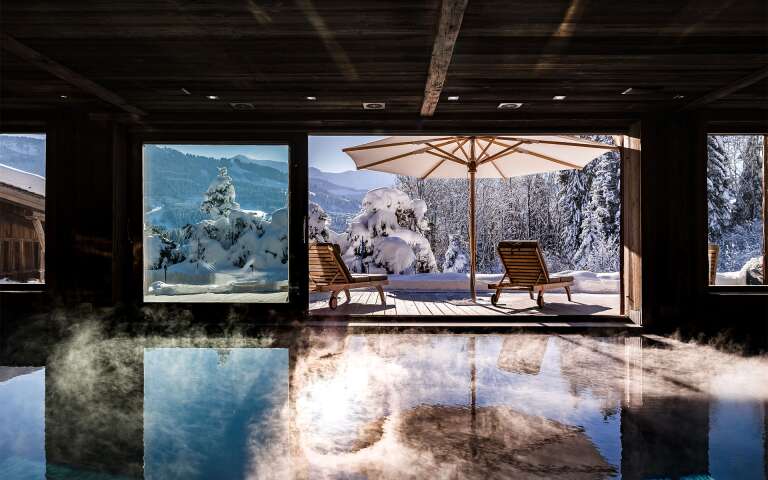 luxury indoor pool with breathtaking mountain views