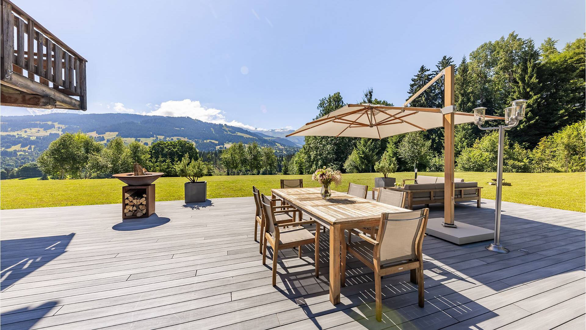 spacious private garden with sitting area and dining table