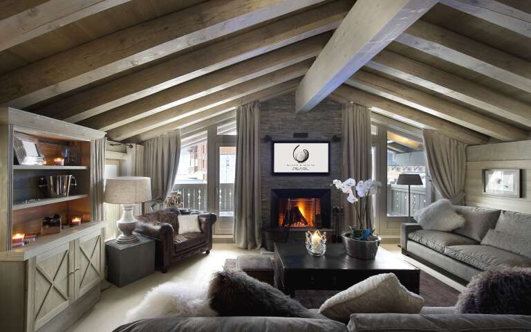 living room with TV and fireplace