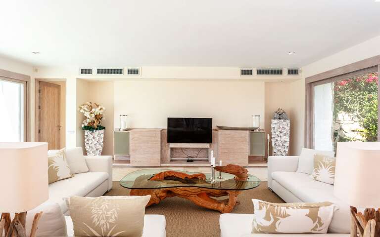 contemporary living room with TV and access to outdoor