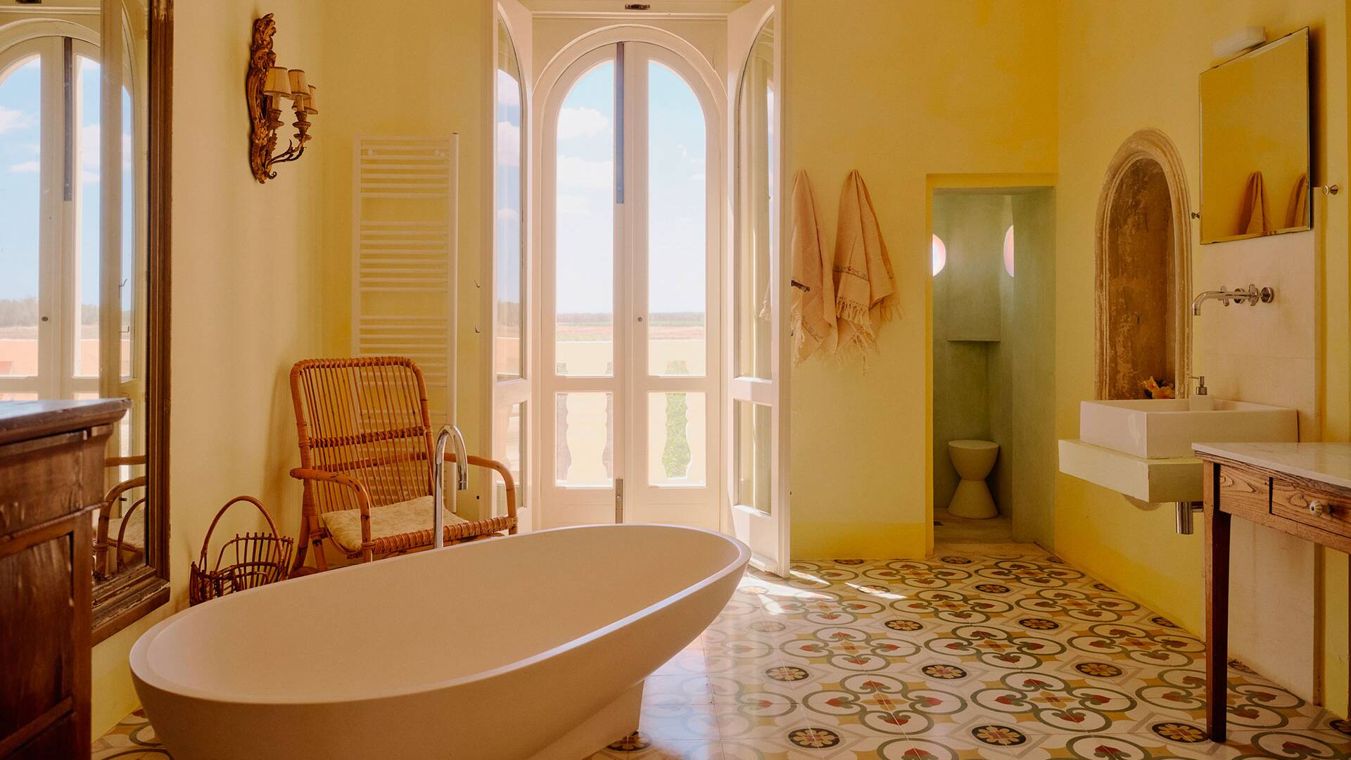 en suite bathroom with freestanding bathtub 