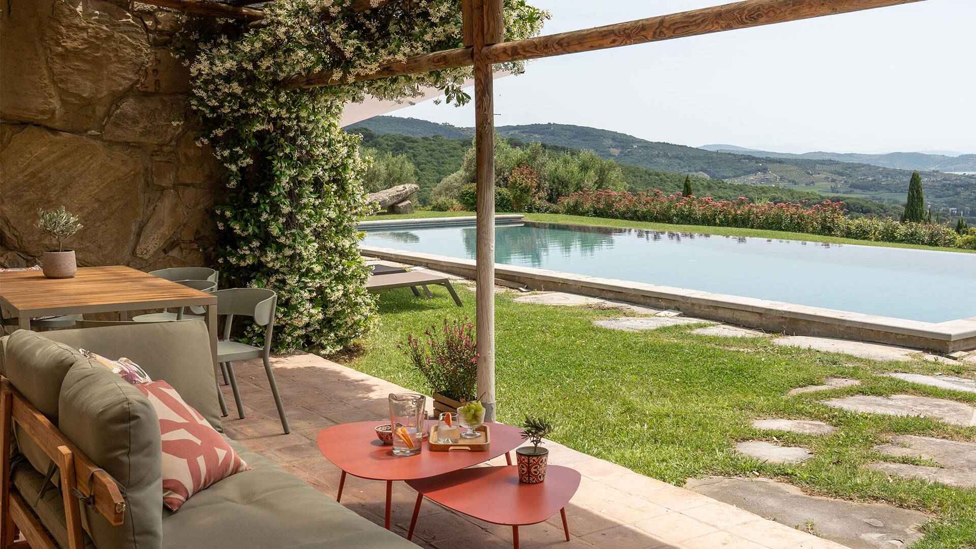 covered sitting area by the pool
