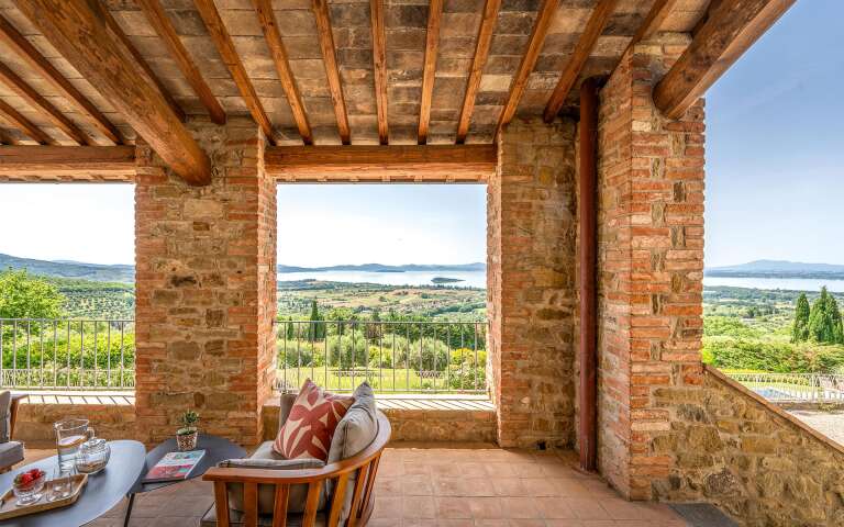 covered sitting area with lake view