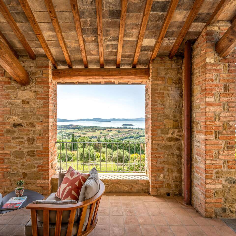 covered sitting area with lake view