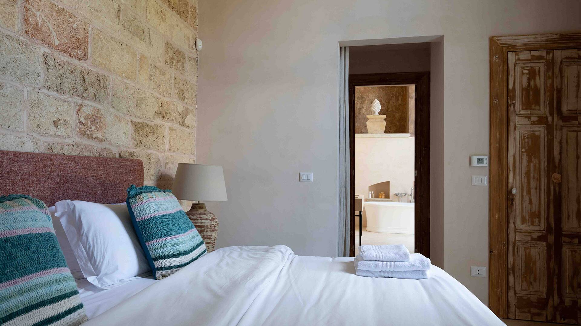 double bedroom with ensuite bathroom and freestanding bathtub
