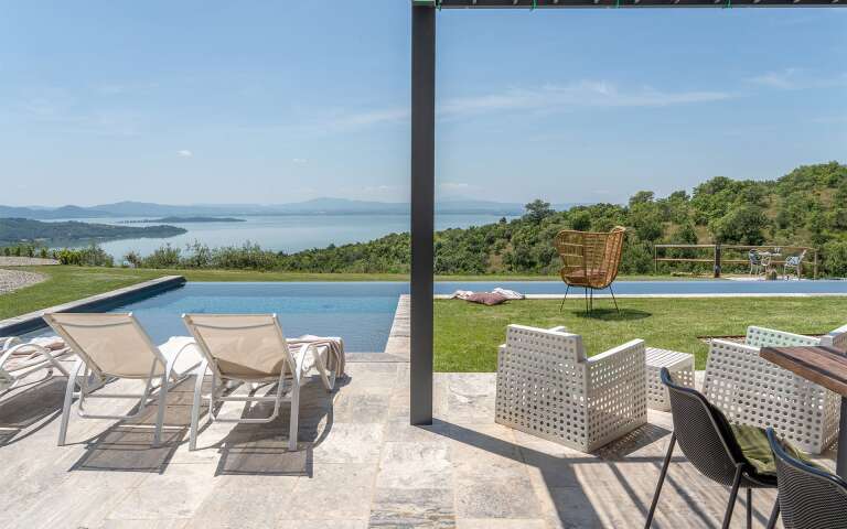 heated pool with sunbathing area