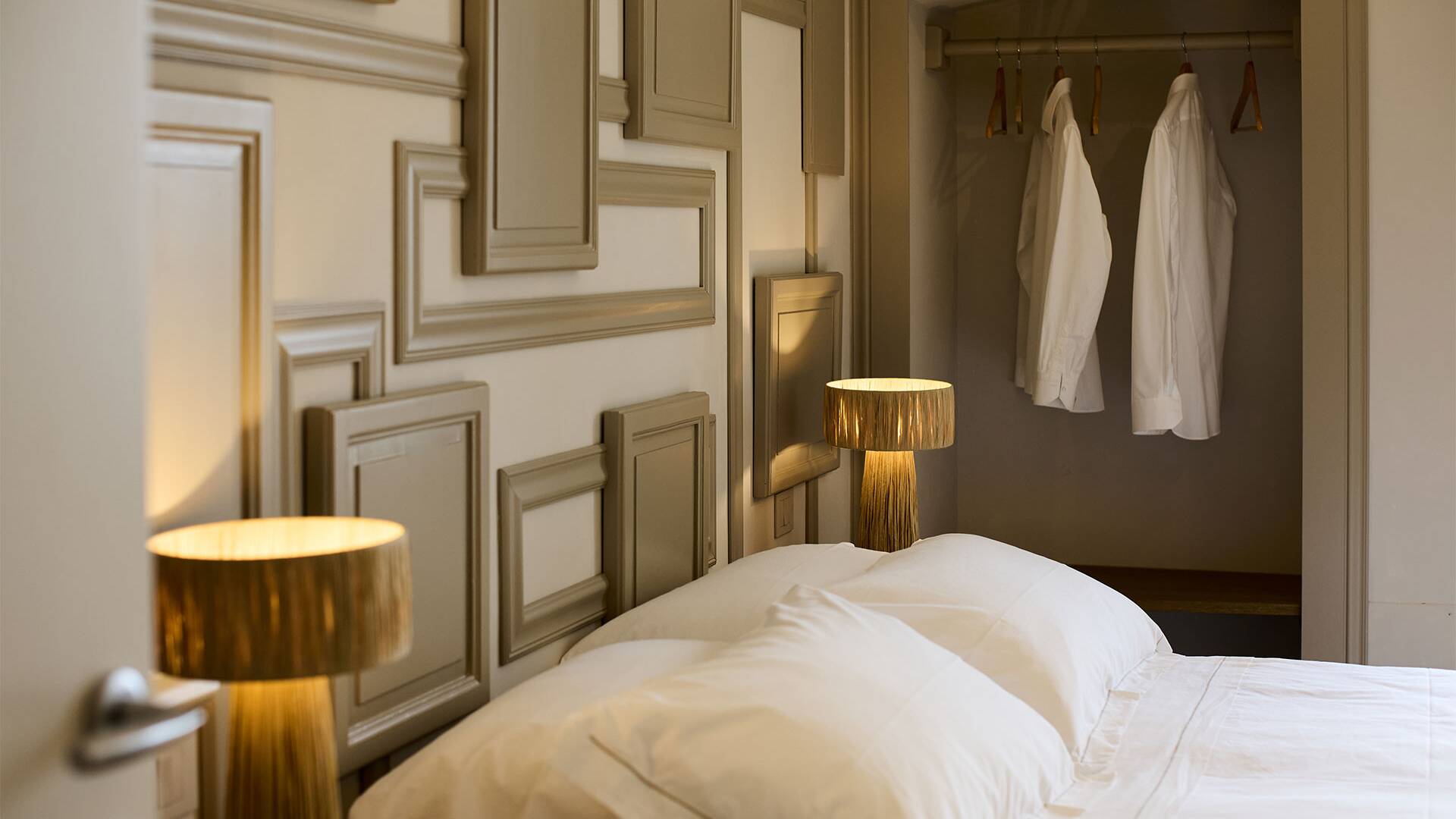 double bedroom with clothes racks