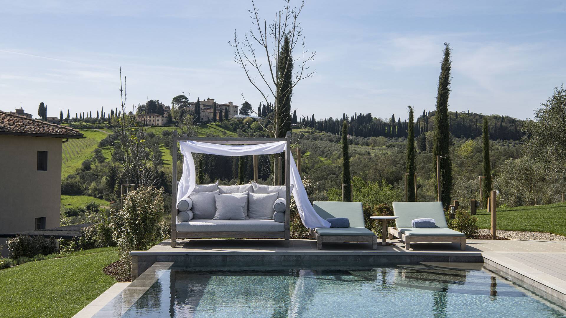sunbeds and cabana by the heated infinity pool