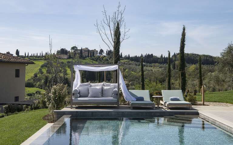 sunbeds and cabana by the heated infinity pool