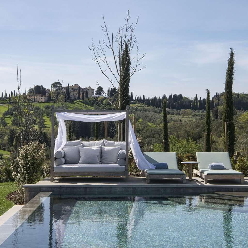 sunbeds and cabana by the heated infinity pool
