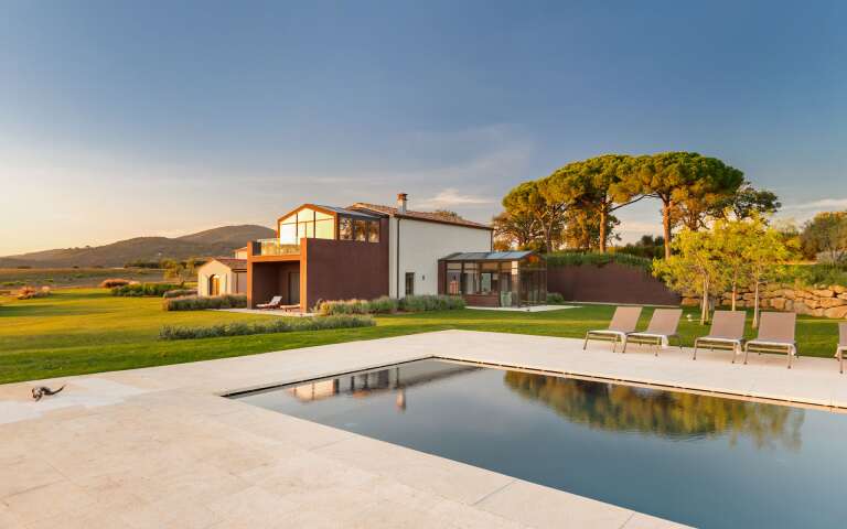 luxury swimming pool and sunbeds
