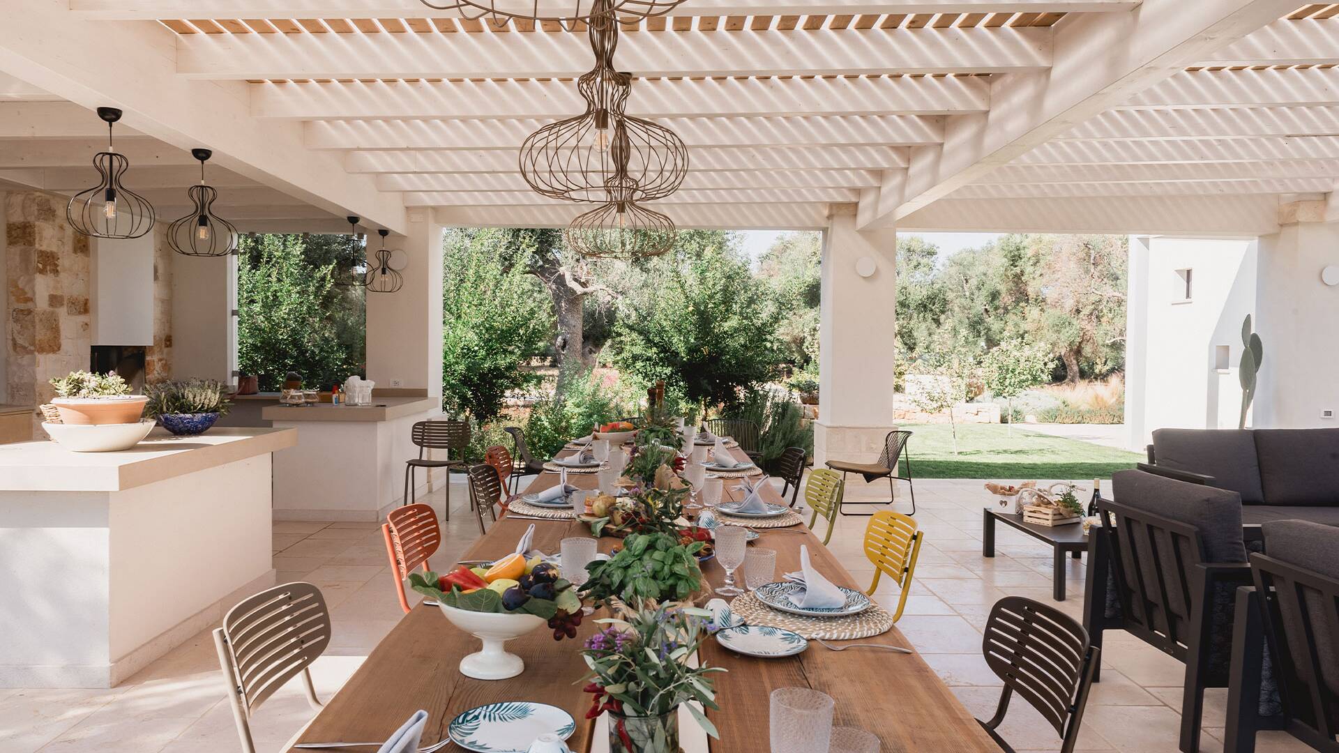 pergola with dining table and open air living space