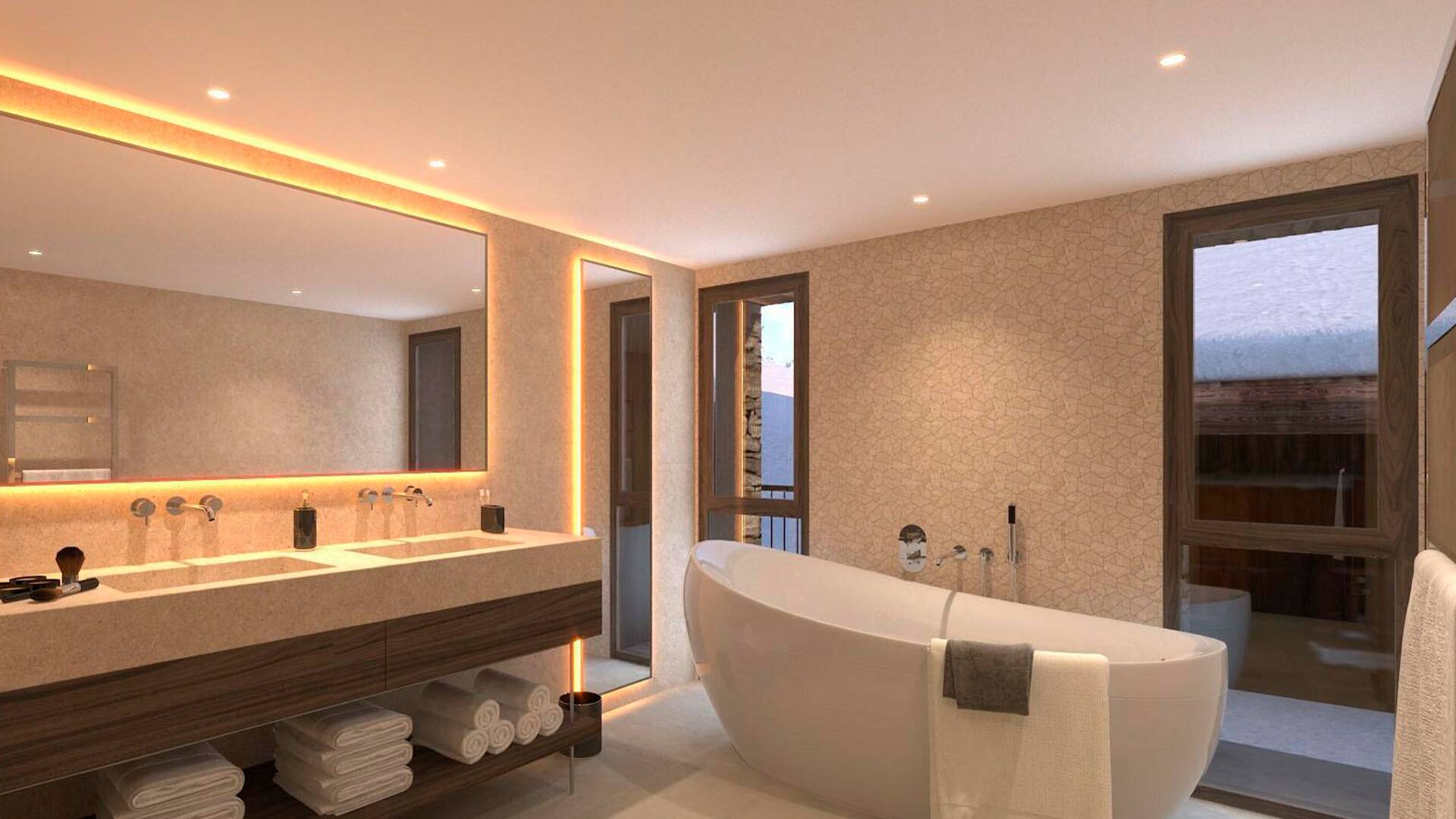 en suite bathroom with free standing bath tub and double basin