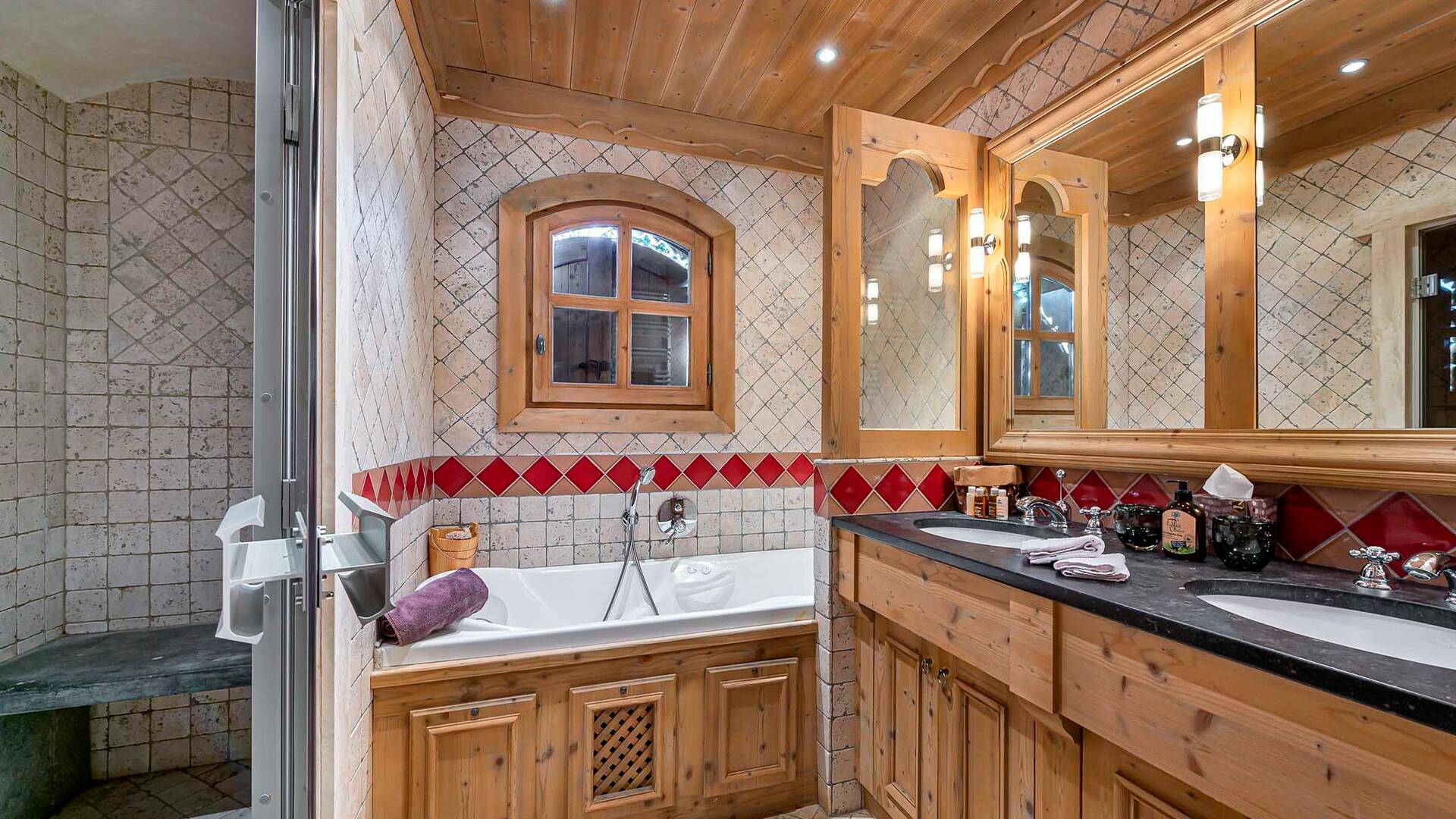en suite bathroom with shower, bath tub and double basin 