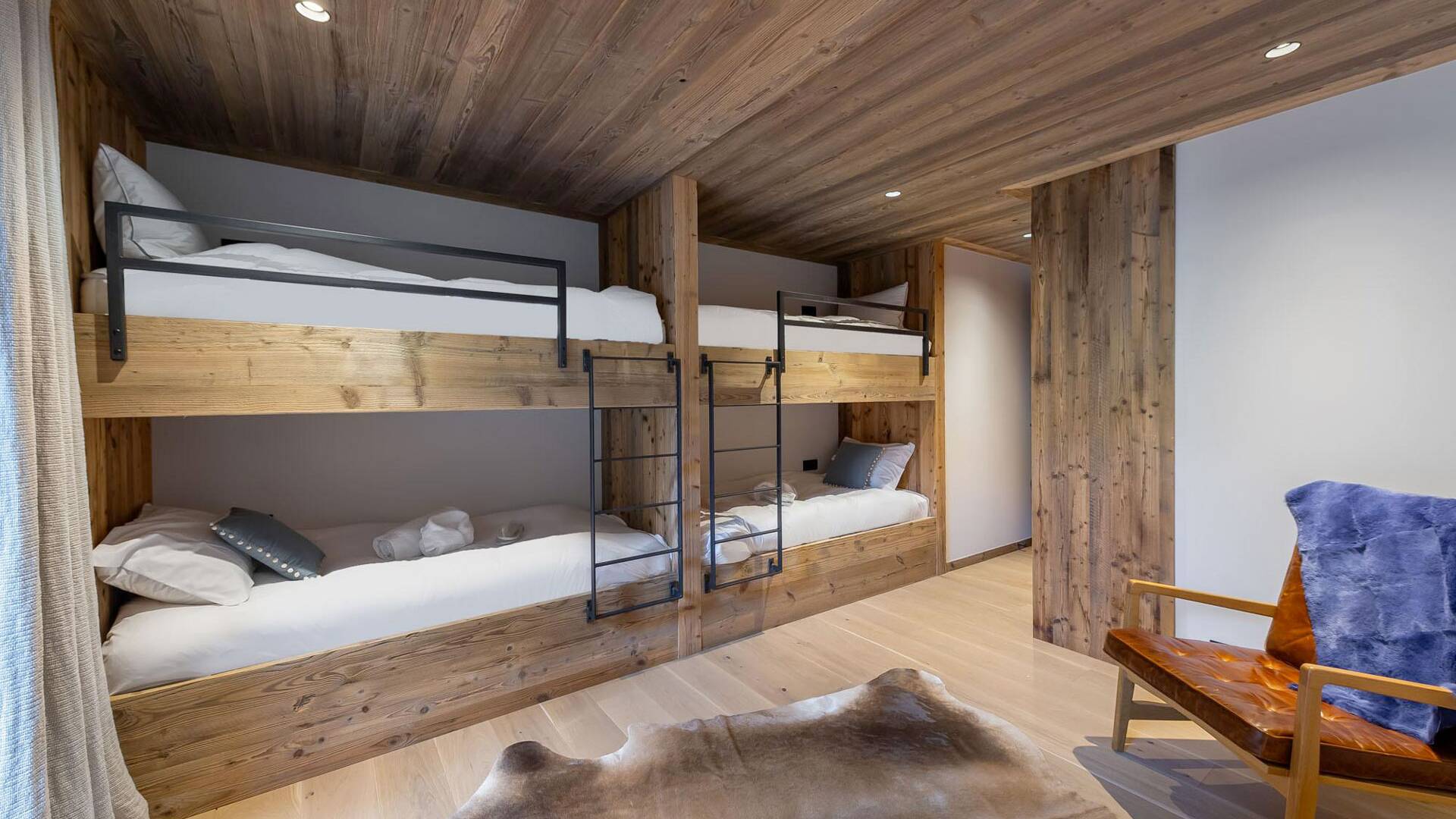 cozy and spacious bedroom featuring a charming bunk bed