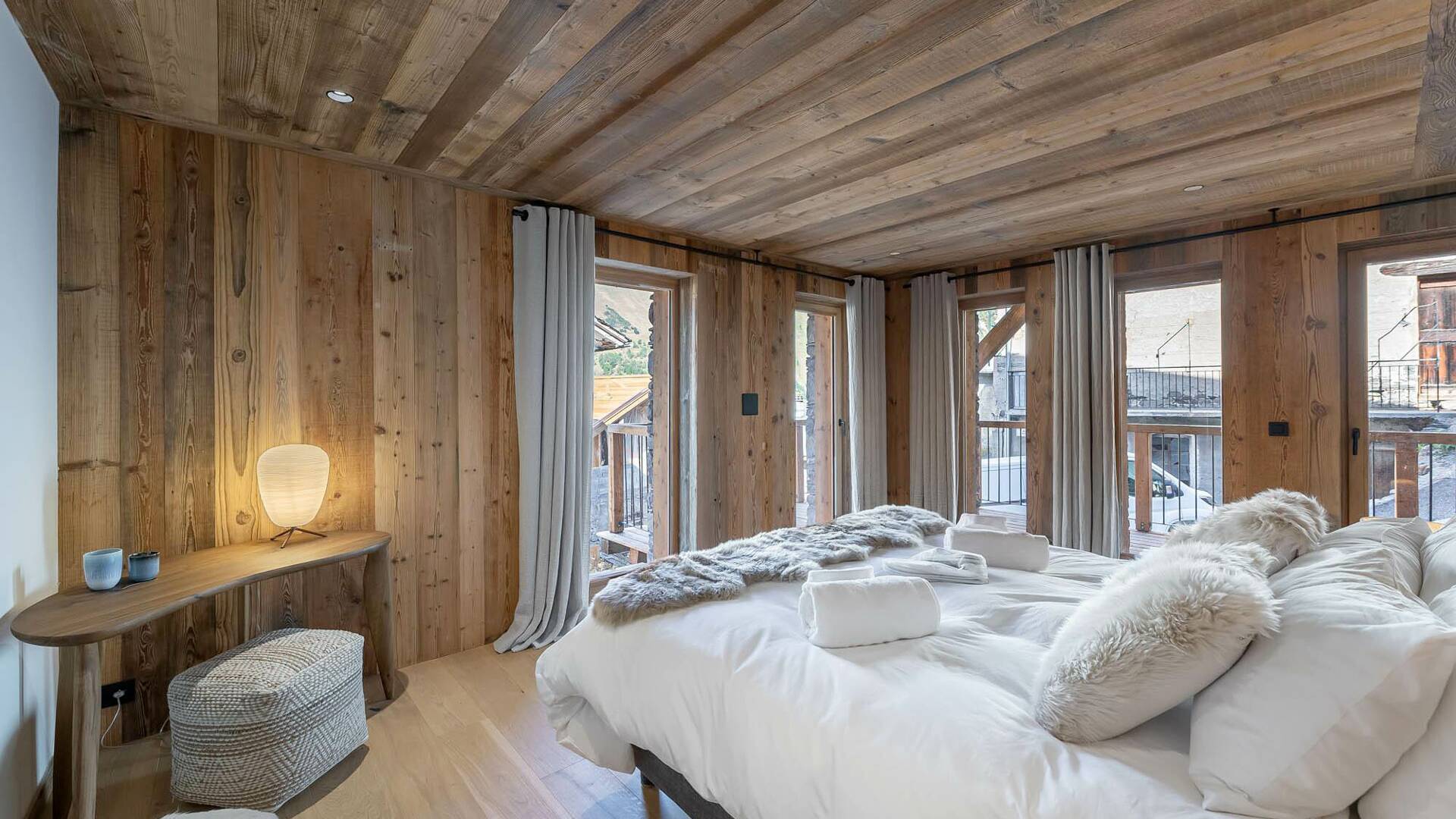 elegant bedroom with en suite bathroom and stunning alpine views