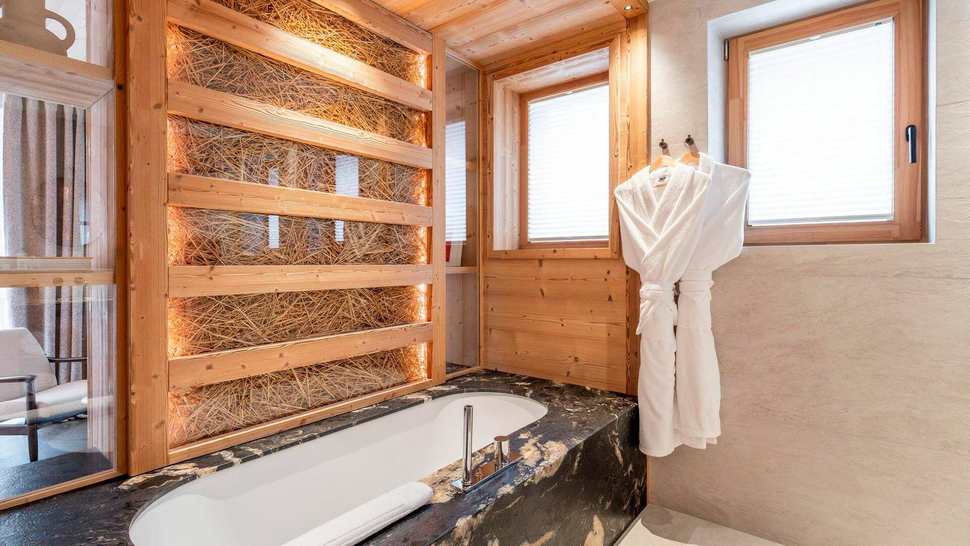 en suite bathroom with bath tub 