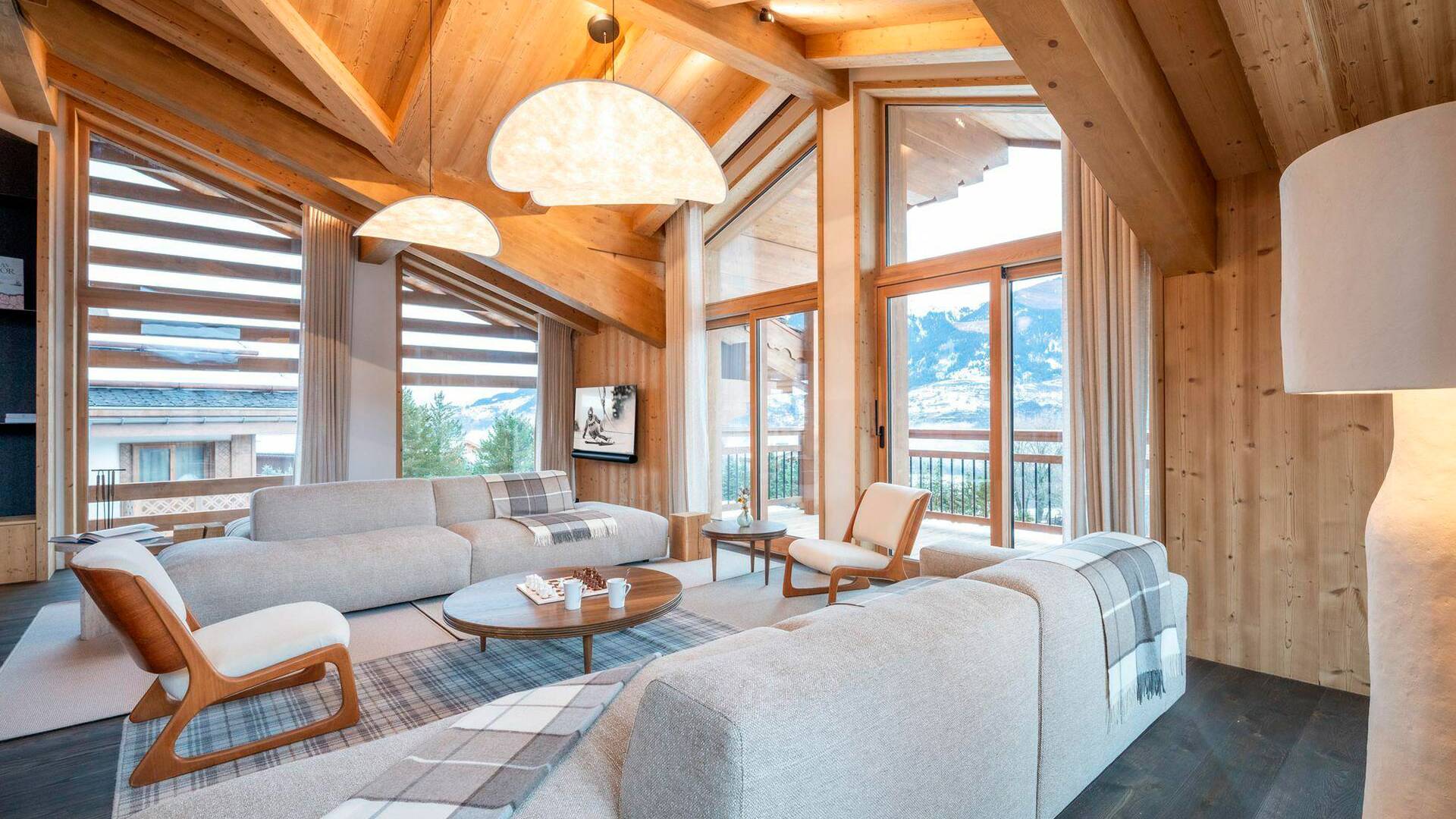 spacious living room with comfortable sofa and armchairs