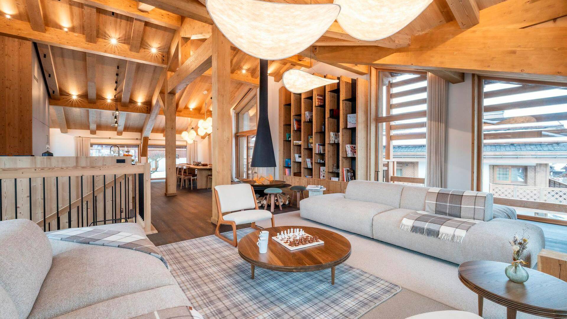 spacious living room with comfortable sofa and armchairs