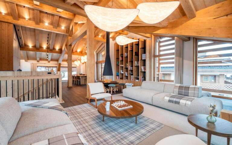 spacious living room with comfortable sofa and armchairs