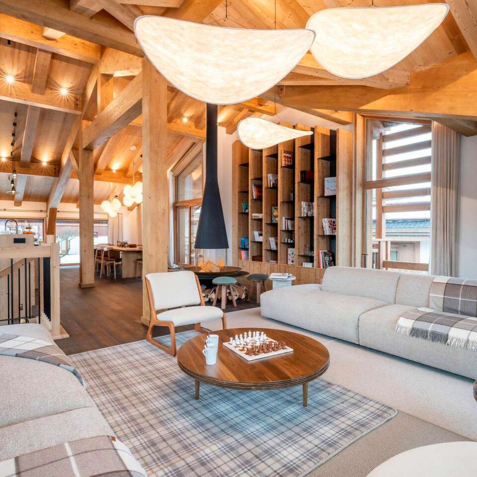 spacious living room with comfortable sofa and armchairs