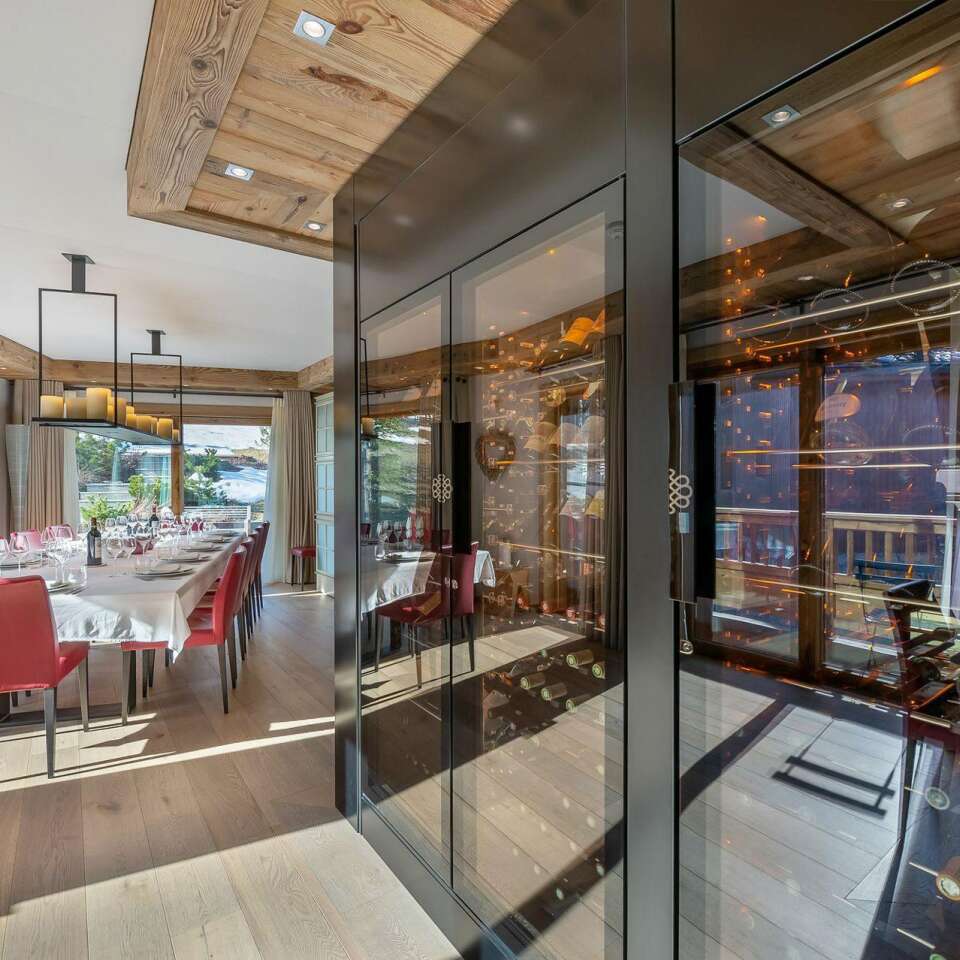 beautiful dining table featuring wine cellar