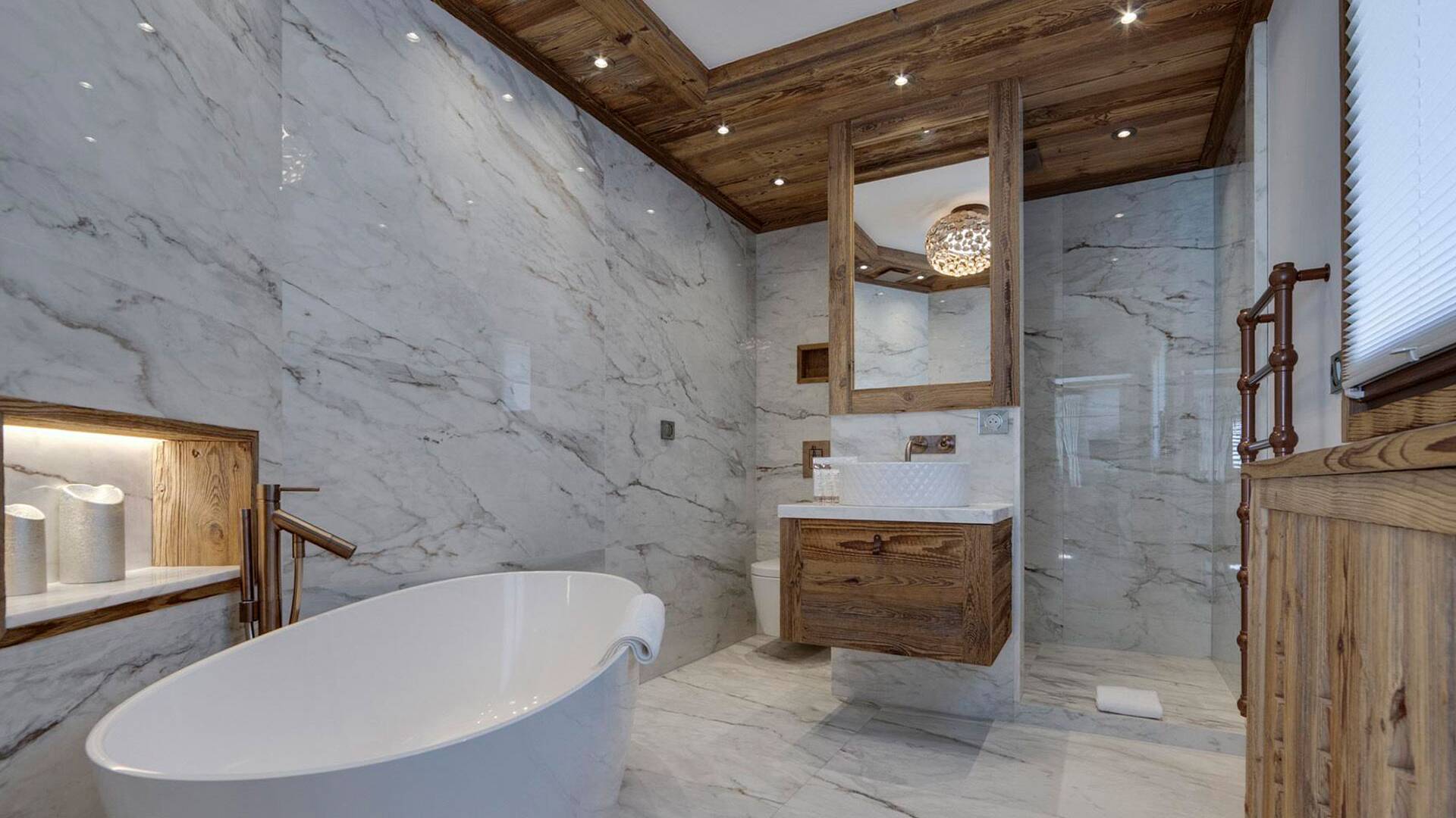 en suite bathroom with standing bath tub and shower