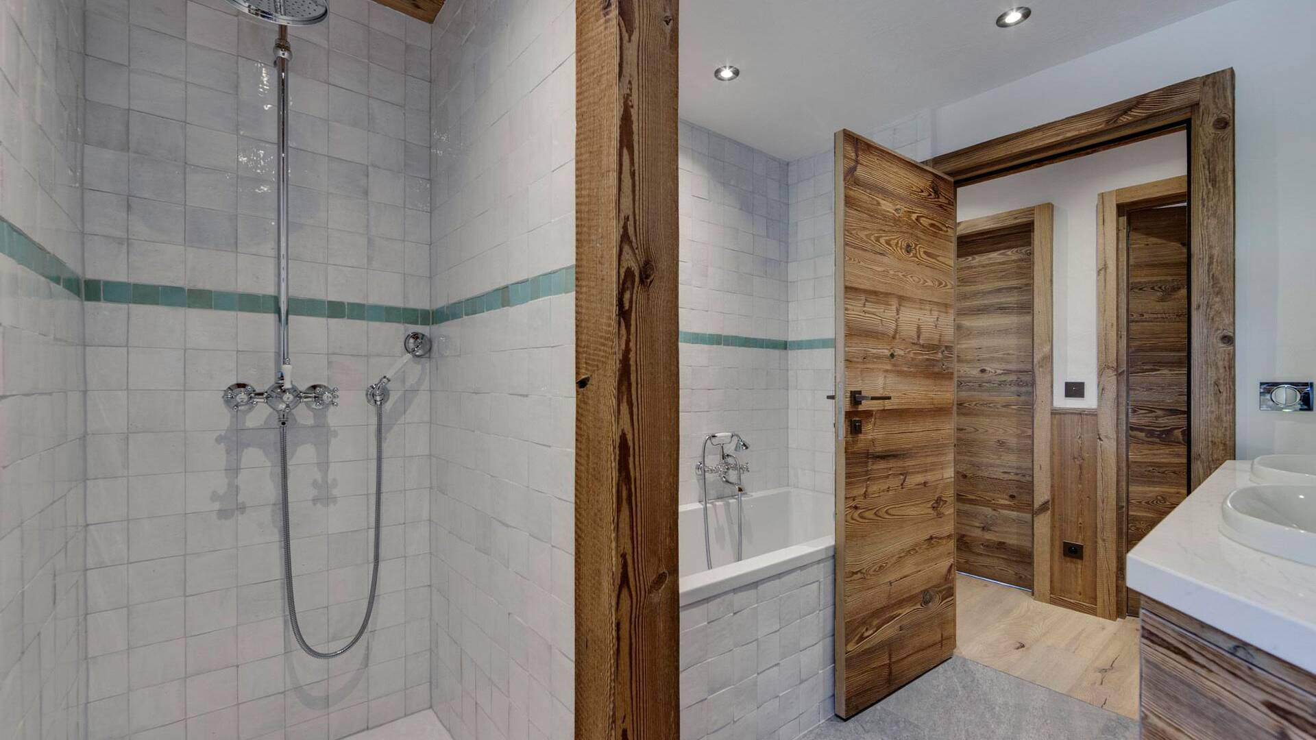 en suite bathroom with shower and bath tub