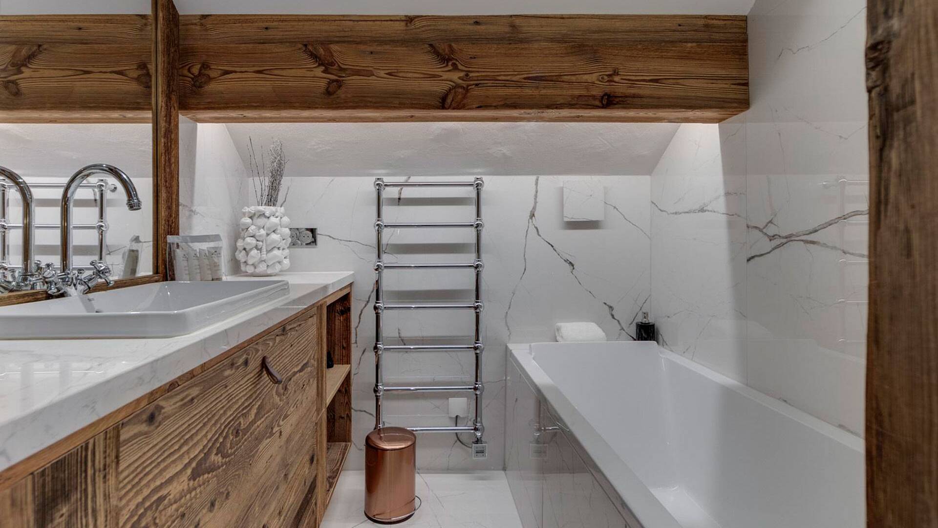 en suite bathroom with bath tub 