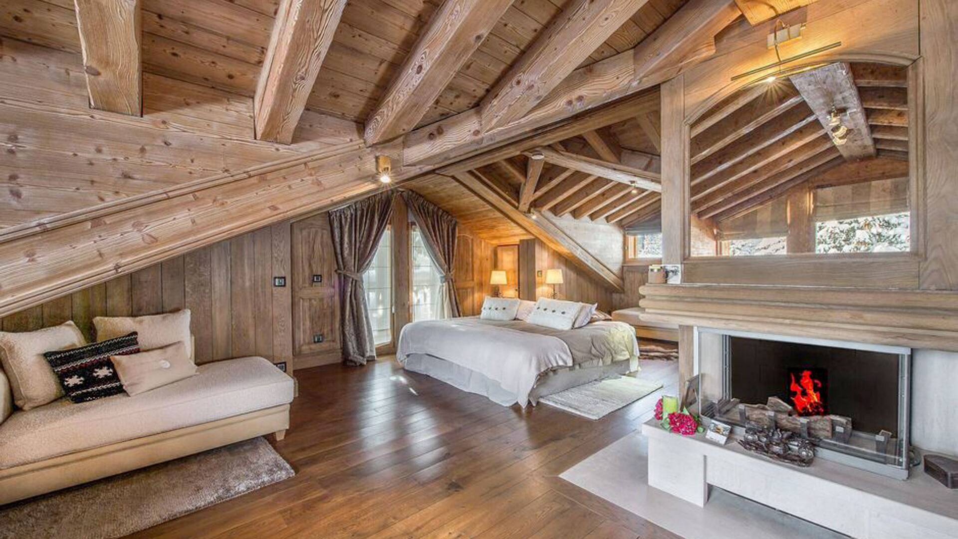 large double bedroom featuring fireplace