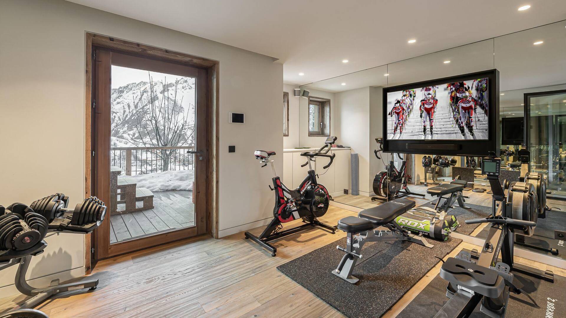 fully equipped gym with tv screen