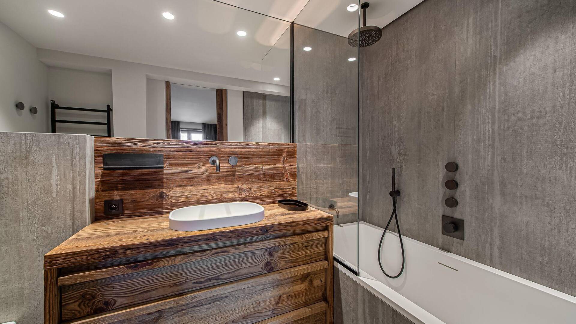 en suite bathroom with bath tub 