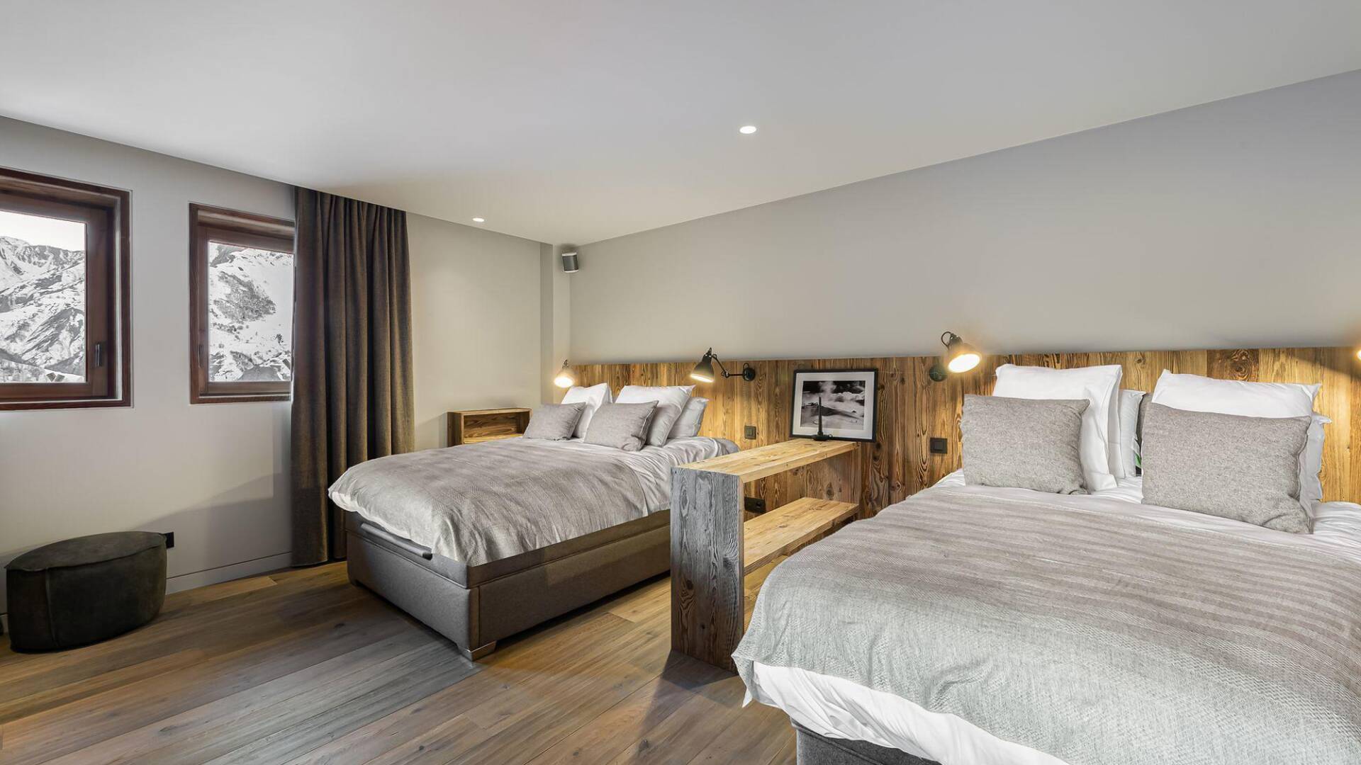 spacious family bedroom with two double beds